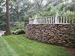 stone wall with fence on top